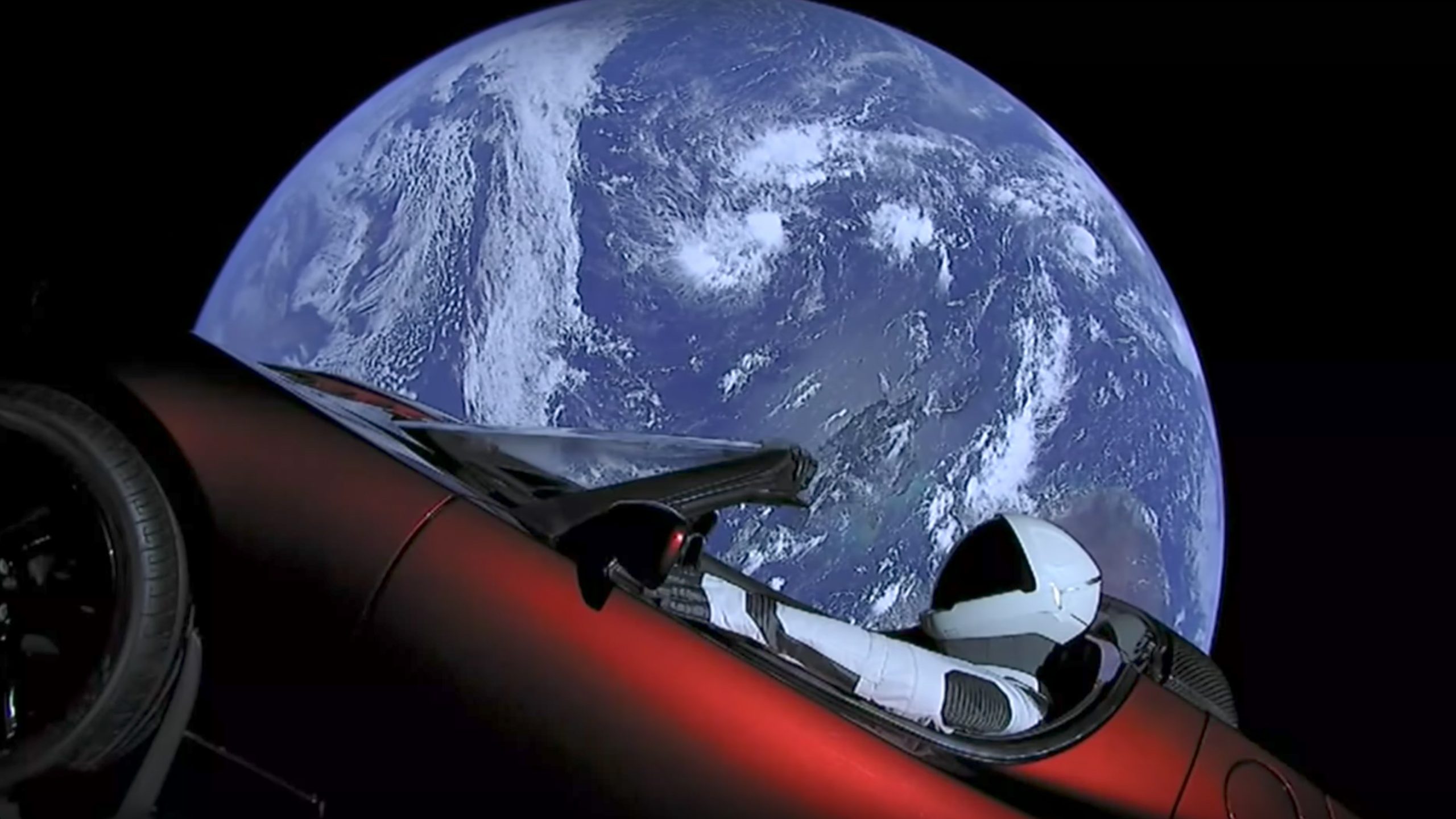 tesla car in space playing music